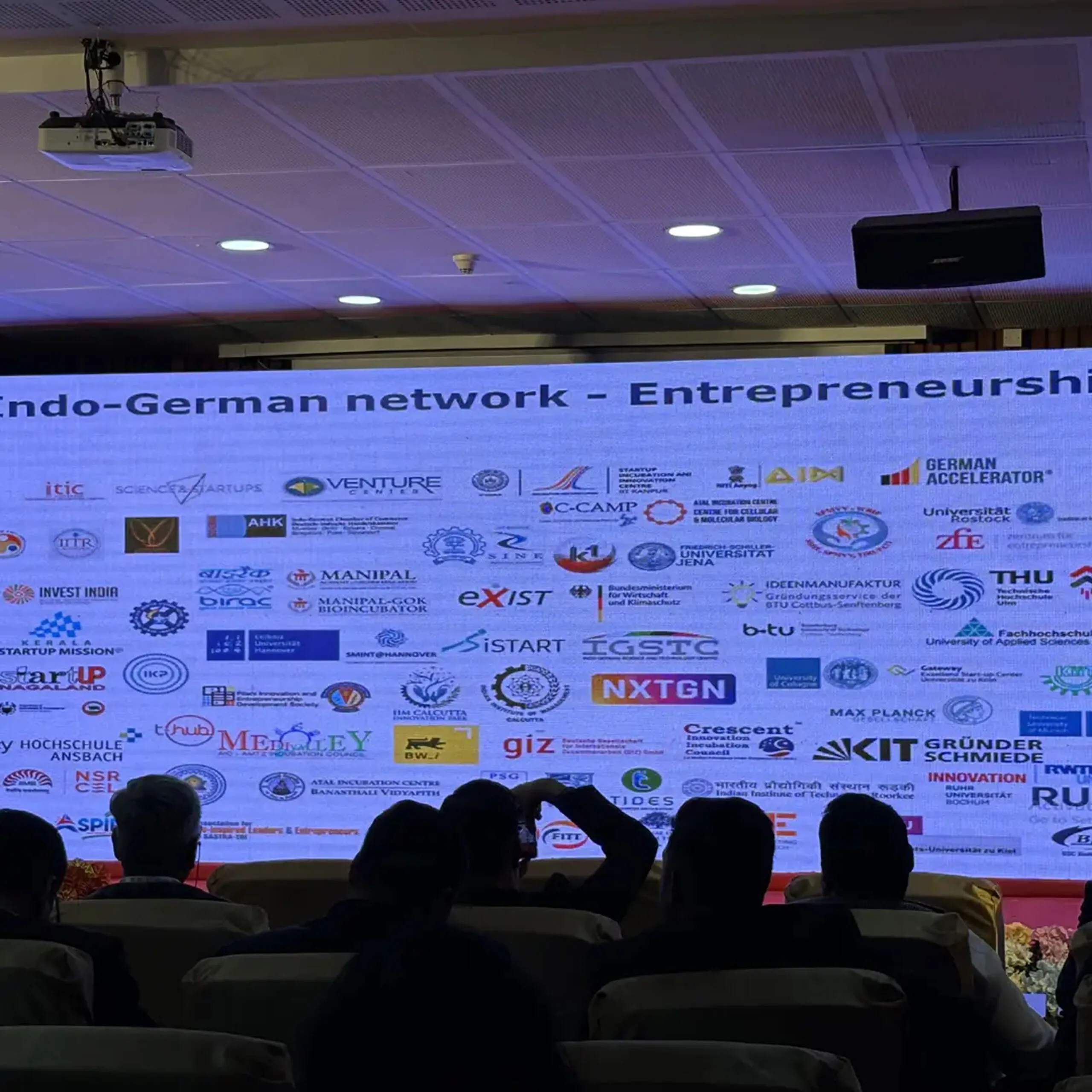 Speakers on stage at ISBACON 2025 under the theme Enabling the Enablers for a Viksit Bharat