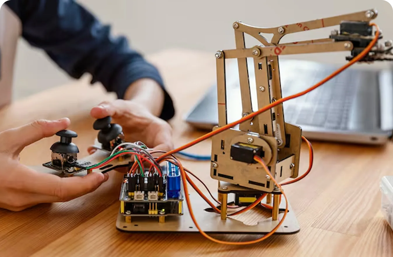 An engineer assembling a circuit board by hand